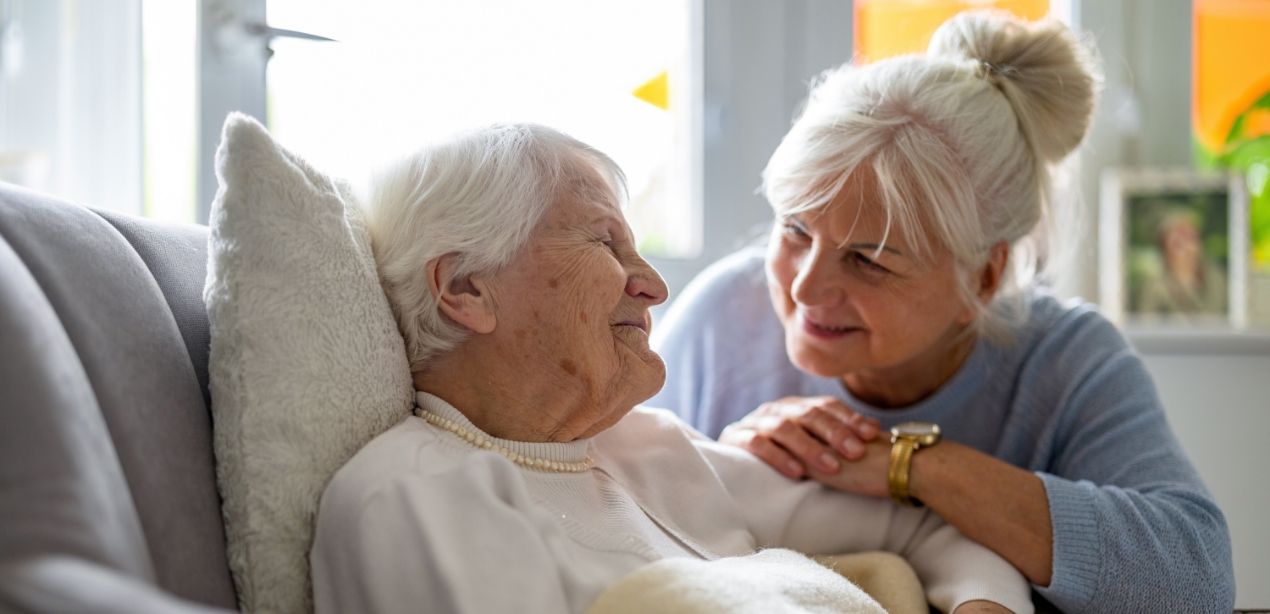A tender long-term care moment at Willow Brook in Delaware, Ohio, used in the two-column section of the Long-Term Care lifestyle page.