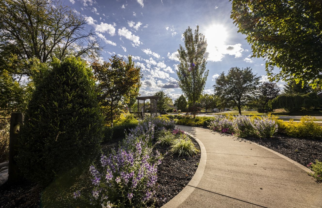 A lavender-lined walking path on the Willow Brook Run campus in Delaware, Ohio, used in the contact page two-column section.